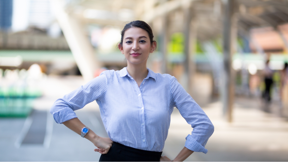woman wearing long-sleeved shirt smiling